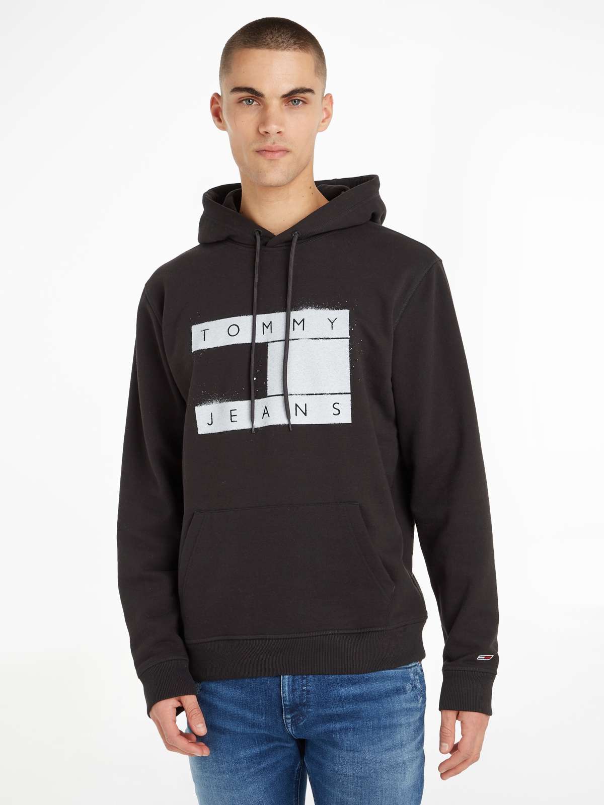 Толстовка с капюшоном»TJM REG FLAG SPRAY HOODIE«